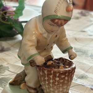 Little boy collecting wood